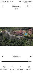 una schermata di un cellulare con la foto di una casa di Fazenda Vista Soberba a Nova Friburgo