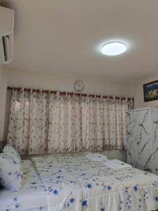 En eller flere senge i et værelse på Airport Link Homestay + 8 billeder