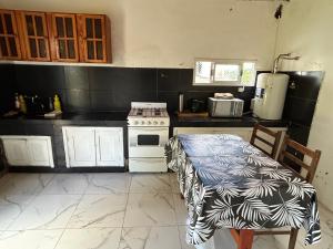 Kuchyň nebo kuchyňský kout v ubytování Alquiler de temporada