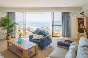 a living room with a couch and a table at The Breakers in Gold Coast +103 photos