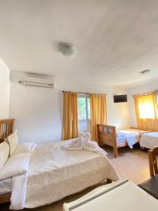 En eller flere senge i et værelse på Posada D`Lua