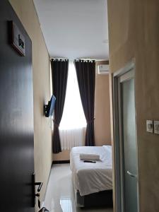 Ένα ή περισσότερα κρεβάτια σε δωμάτιο στο 3S Guest House