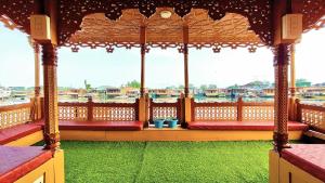 an outdoor gazebo with a view of the water at Houseboat Ambassador in Srinagar