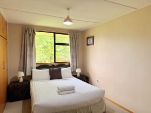 Ένα ή περισσότερα κρεβάτια σε δωμάτιο στο Kiwi Holidays in Cromwell