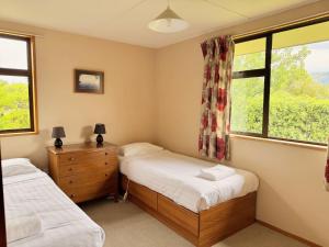 Ένα ή περισσότερα κρεβάτια σε δωμάτιο στο Kiwi Holidays in Cromwell +12 φωτογραφίες