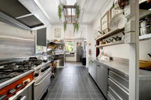 a large kitchen with stainless steel appliances at The Globe in Castlemaine