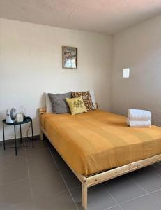 En eller flere senge i et værelse på Casa Nena