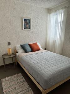 En eller flere senge i et værelse på Casa Nena