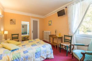 Voodi või voodid majutusasutuse Hôtel du Val d'Aure toas