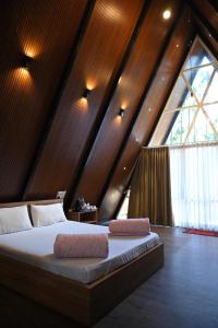 Postel nebo postele na pokoji v ubytování Coffee Gudda + 92 fotografií