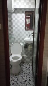 a bathroom with a toilet and a sink at Everest Base Cam Hostel in Hong Kong +18 photos