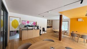 a living room with a table and a dining room at WildChild in Hakuba