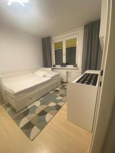 En eller flere senge i et værelse på Centrum u Magdy