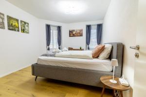 En eller flere senge i et værelse på Jasminkas Host 3 - Stadtwohnung mit Küche & gratis Parkplatz