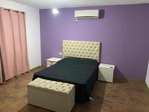 En eller flere senge i et værelse på Casa de verano - alquiler temporario + 7 billeder