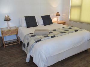 Ένα ή περισσότερα κρεβάτια σε δωμάτιο στο Point Village Accommodation - Point Road 20 +2 φωτογραφίες