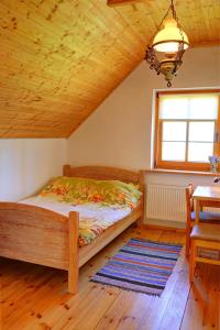 Posteľ alebo postele v izbe v ubytovaní Apartament w Muzeum Michała Kajki