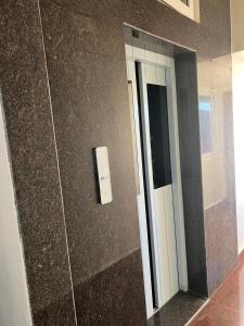 a bathroom with a mirror on the wall at Hotel ODC Residency in Jowai