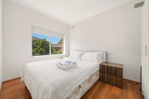 En eller flere senge i et værelse på Hillsdale Affordable Cottage