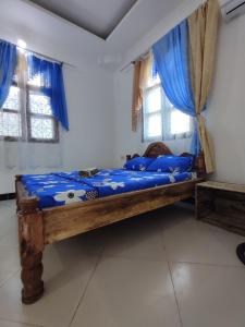 En eller flere senge i et værelse på Kwa Mzungu Villa