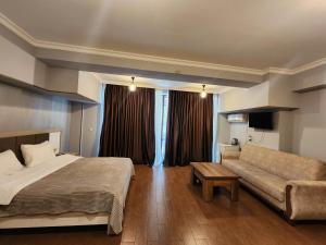 Ένα ή περισσότερα κρεβάτια σε δωμάτιο στο Geo Palace Kolkheti National Park