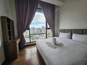 En eller flere senge i et værelse på Opus Residences by Star Haven + 81 billeder