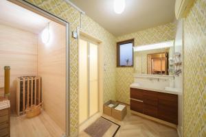 a bathroom with a shower and a sink and a mirror at Triangle 2nd in Beppu +27 photos