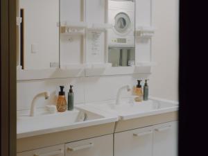 Koupelna v ubytování 千秋楽 + 25 fotografií