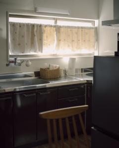 Kuchyň nebo kuchyňský kout v ubytování 千秋楽