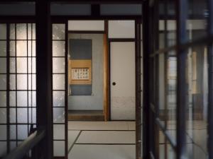 a view of a door through a glass doorway at 千秋楽 in Tamano