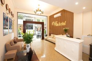 a living room with a waiting area with a store at Hanoi Win Hotel & Travel in Hanoi