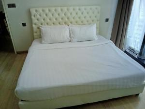 En eller flere senge i et værelse på Star residence klcc by S&S + 71 billeder