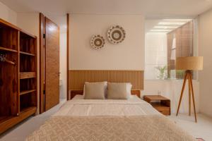 En eller flere senge i et værelse på SandWave Villa