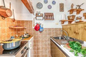 a kitchen with a sink and a counter top at Appartamento Big Lem - Happy Rentals in Sauze d'Oulx