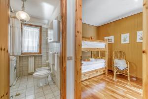 a bedroom with a bunk bed and a toilet at Appartamento Big Lem - Happy Rentals in Sauze d'Oulx +24 photos