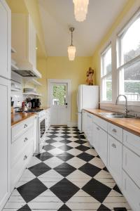 a kitchen with a black and white checkered floor at Heights Ironworks Bed & Breakfast in Houston