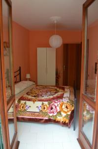 A bed or beds in a room at La Sorgente B&B