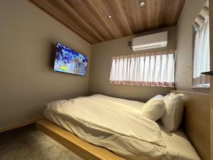 Кровать или кровати в номере Nakazaike +14 фотографий