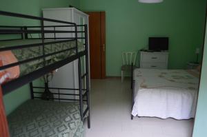 A bed or beds in a room at La Sorgente B&B