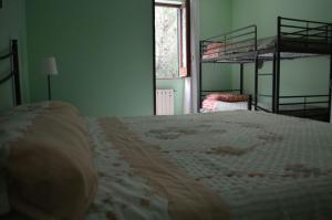 A bed or beds in a room at La Sorgente B&B