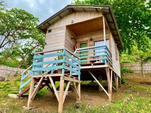 a small house with blue stairs and a door at 7 Ventos in Alto Douro