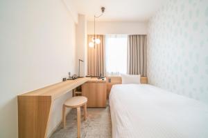 Ένα ή περισσότερα κρεβάτια σε δωμάτιο στο Center Hotel Tokyo