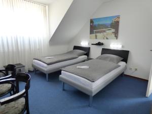 Posezení v ubytování Hotel Alt Büttgen