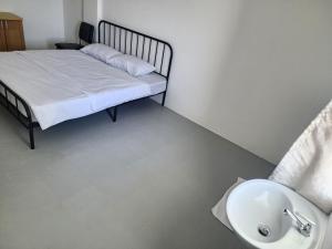 En eller flere senge i et værelse på Toucan Garden