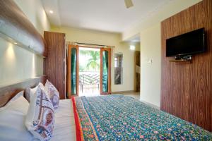 TV a/nebo společenská místnost v ubytování Eufregina Resort & Spa - South Goa