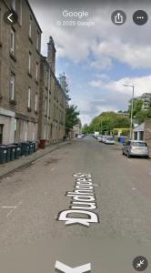 een lege straat met een nummer op de weg geschilderd bij DS Study or Visit in Dundee