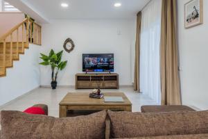 Et tv og/eller underholdning på City Gardens Villa
