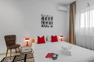 En eller flere senge i et værelse på City Gardens Villa