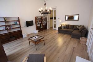 a living room with a couch and a table at Sissy Apartment in Budapest