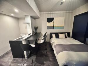 Ένα ή περισσότερα κρεβάτια σε δωμάτιο στο Lifement glanz sakaimachi